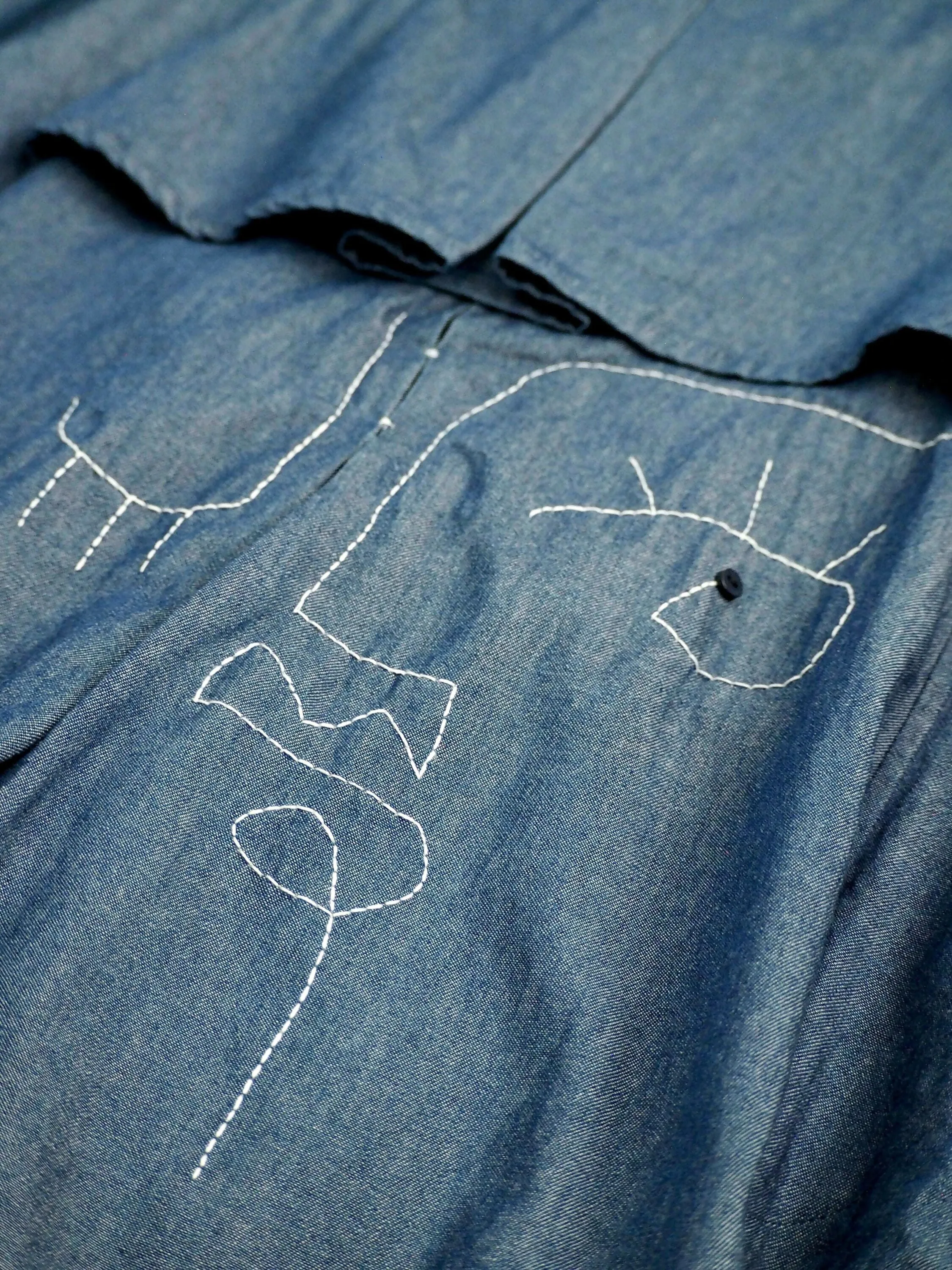 Elle Denim Abstract Face Cape Coat