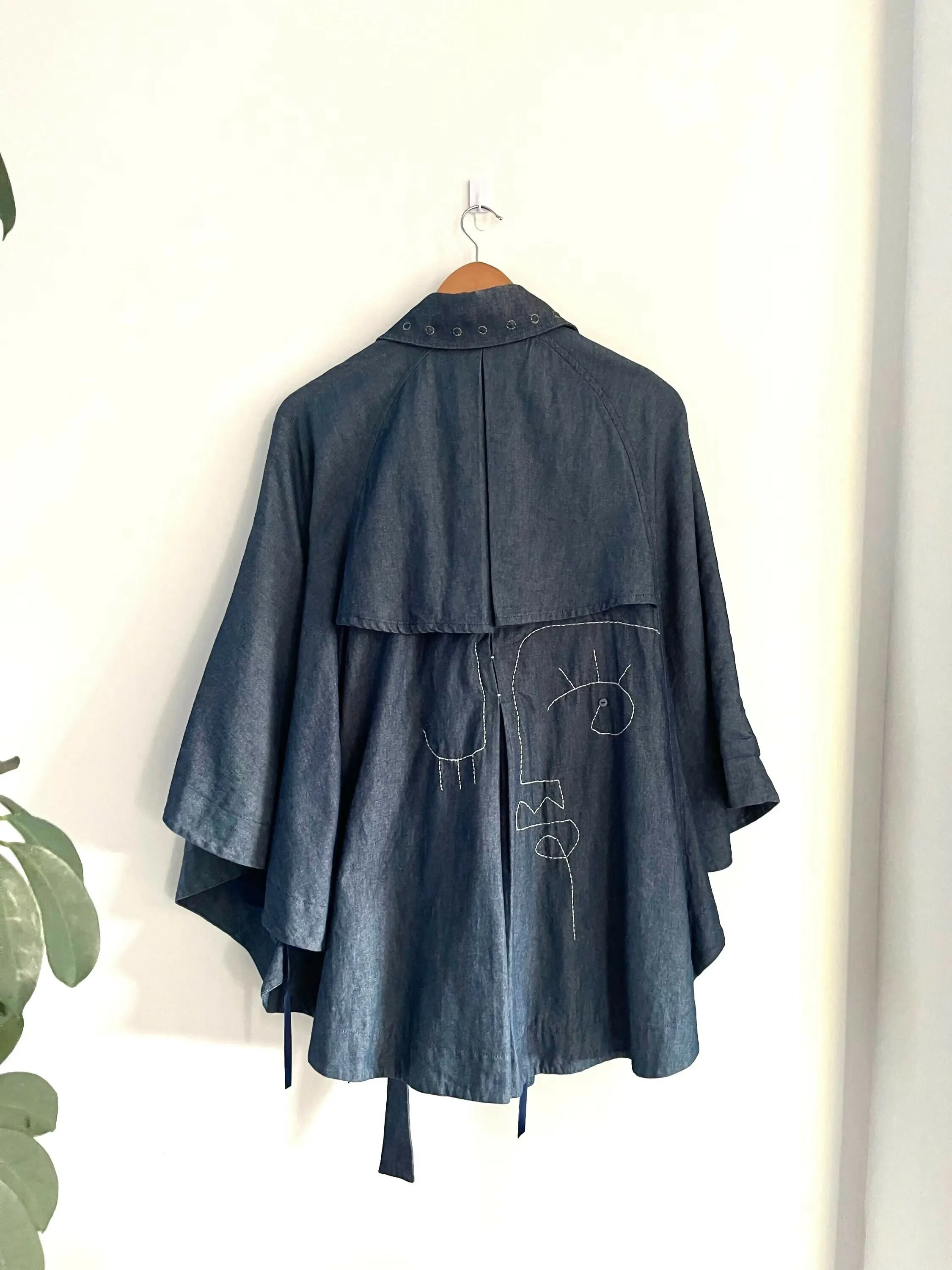Elle Denim Abstract Face Cape Coat